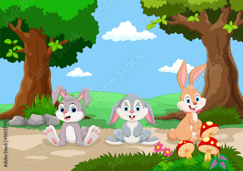 Cute little rabbits cartoon with a background of a beautiful garden 