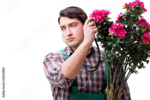 Young man gardener isolated on white