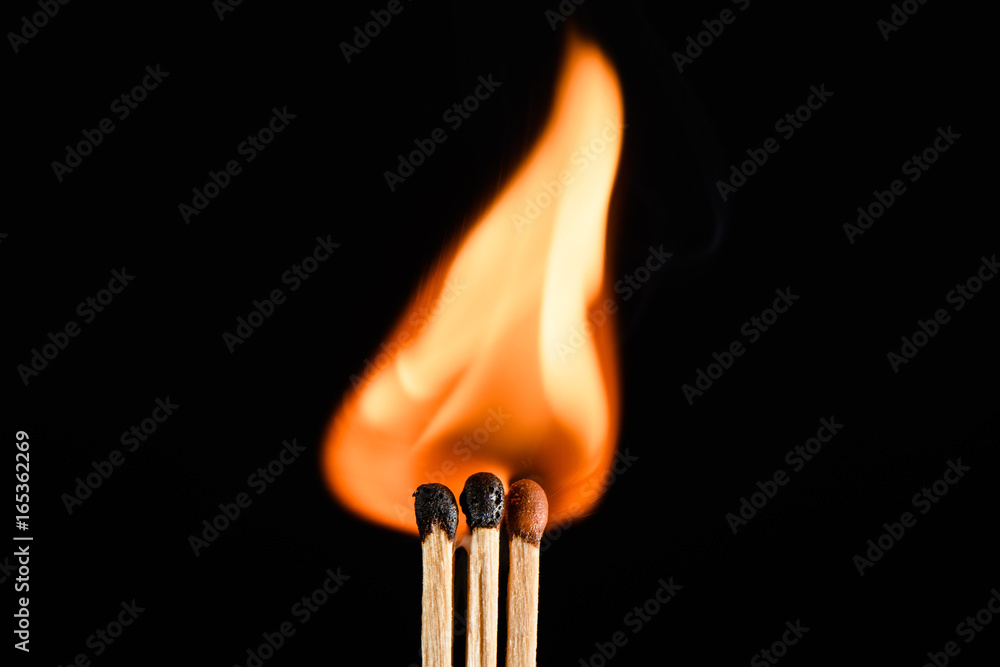 Three the flaring match isolated on black background Three the flaring match isolated on black background