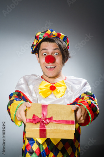 Funny clown in comical concept