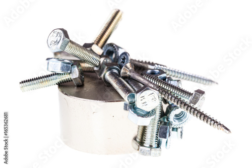 Screws and bolts on a neodymium magnet