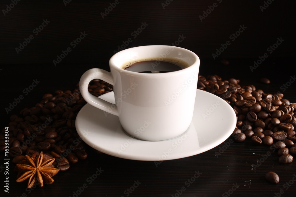 White glass of coffee and coffee beans White glass of coffee and coffee beans