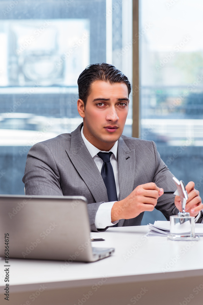Businessman with star award in office Businessman with star award in office