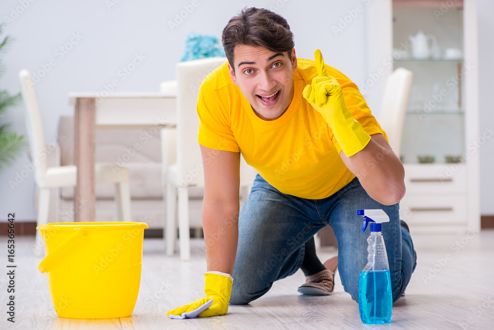 Young man doing chores at home Young man doing chores at home
