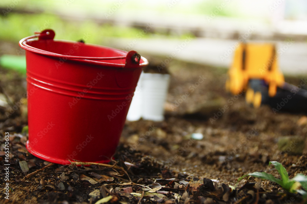 Empty Bucket On The Ground In The garden Empty Bucket On The Ground In The garden