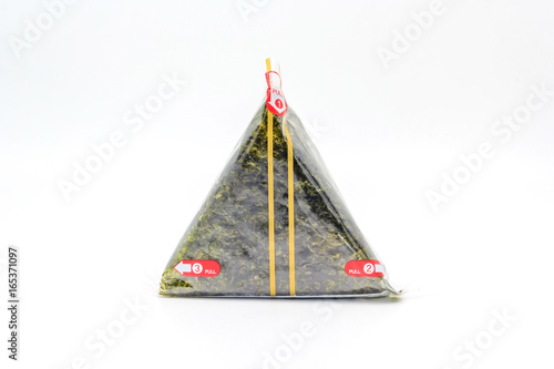Portable Onigiri a Japanese rice ball wrapped with seaweed in sealed plastic on white background, with Copy space and text.
