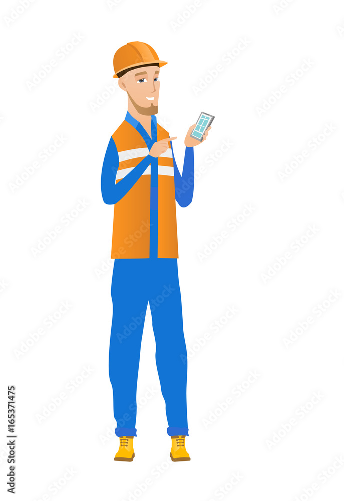Young caucasian builder holding a mobile phone. Young caucasian builder holding a mobile phone.