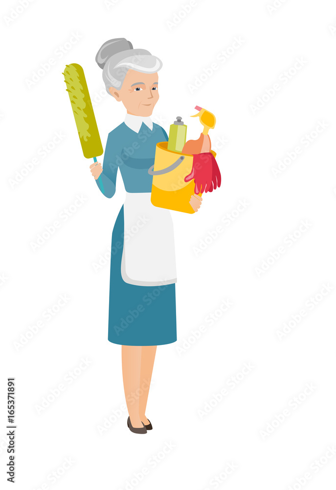 Cleaner holding bucket full of cleaning equipment. Cleaner holding bucket full of cleaning equipment.