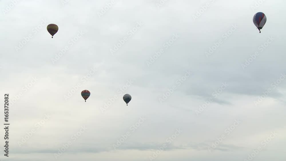 Several hot air balloons in the sky aerial view Several hot air balloons in the sky aerial view