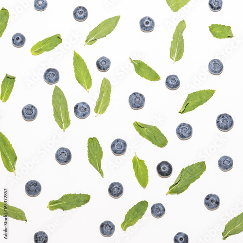 Blueberries and mint leaves pattern isolated on white background