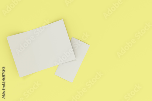 Blank white open three fold brochure mockup on yellow background