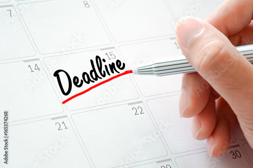 Deadline text on the calendar (or desk planner) underlined with red marker