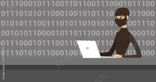 Hacker using laptop to steal information.