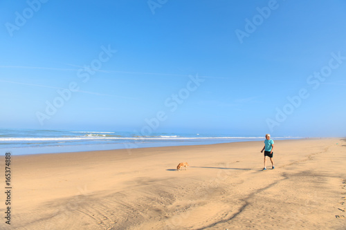 Man and dog at the beach
