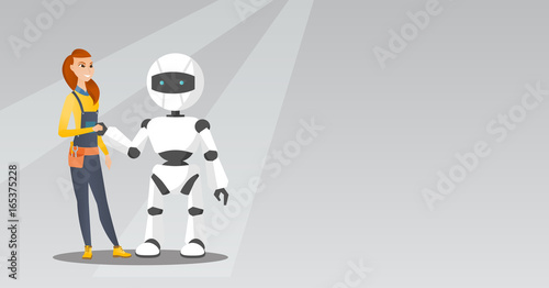 Young caucasian woman handshaking with robot.