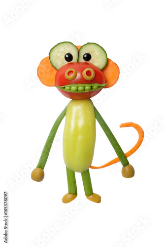 Monkey made of fresh vegetables on white background