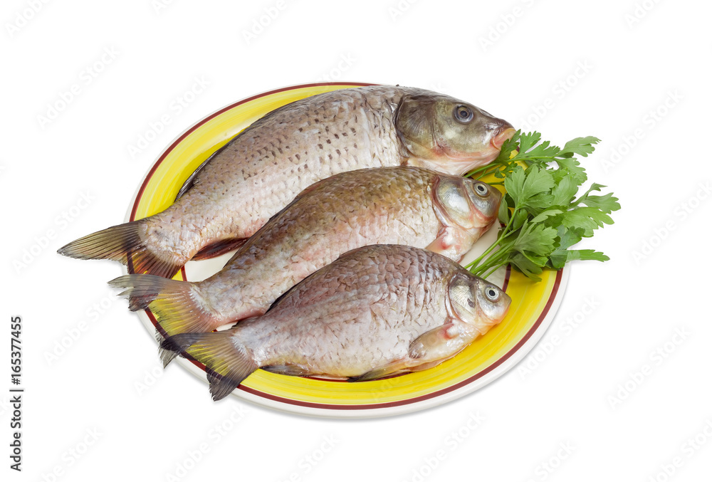 Carp and crucians prepared for cooking on dish Carp and crucians prepared for cooking on dish