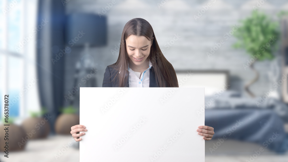 Young beautiful business woman and creative designer standing over blured interior background Young beautiful business woman and creative designer standing over blured interior background