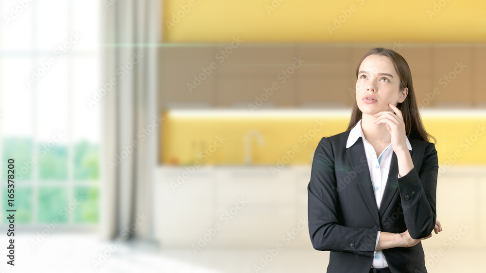 Young beautiful business woman and creative designer standing over blured interior background Young beautiful business woman and creative designer standing over blured interior background