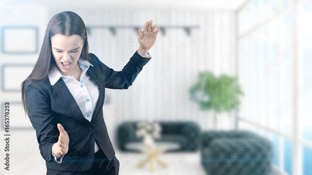 Young beautiful business woman and creative designer standing over blured interior background Young beautiful business woman and creative designer standing over blured interior background