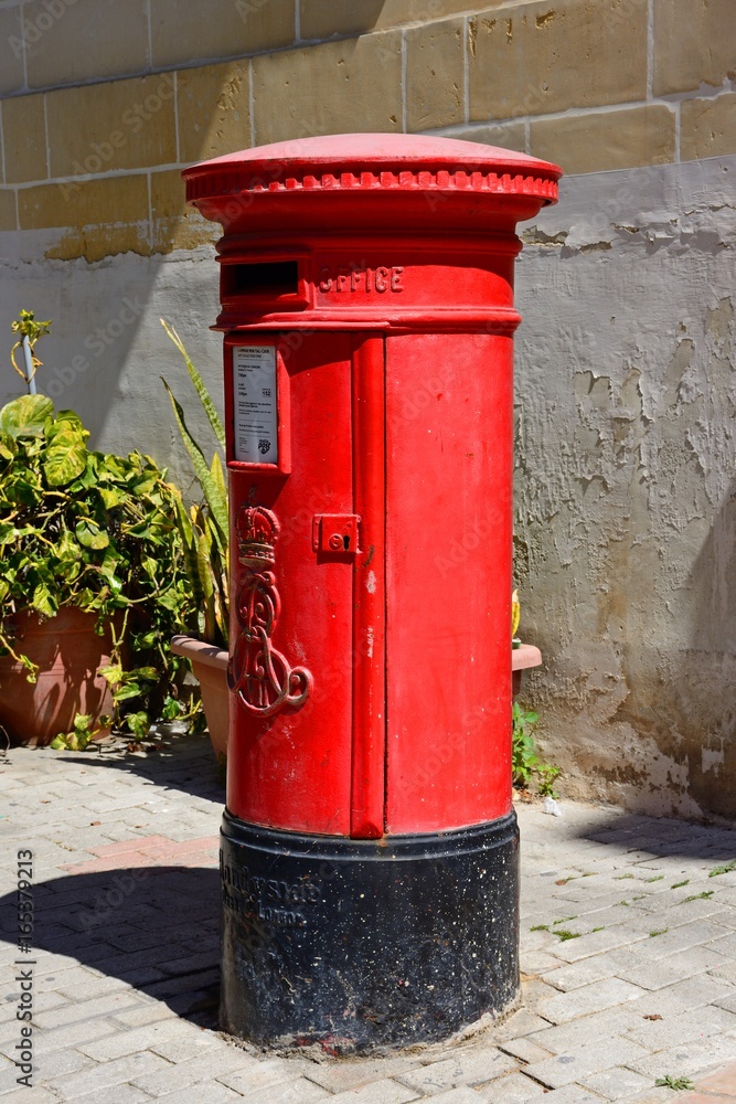 Traditional red British post box, Vittoriosa, Malta. Traditional red British post box, Vittoriosa, Malta.