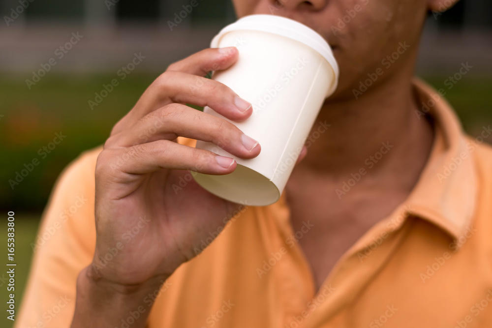 Man drinking coffee on cup white color. Man drinking coffee on cup white color.