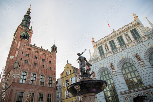 Fountain of the Neptune in old town of Gdansk, Main City Hall and Square in the city center, a famous historical landmark, Poland