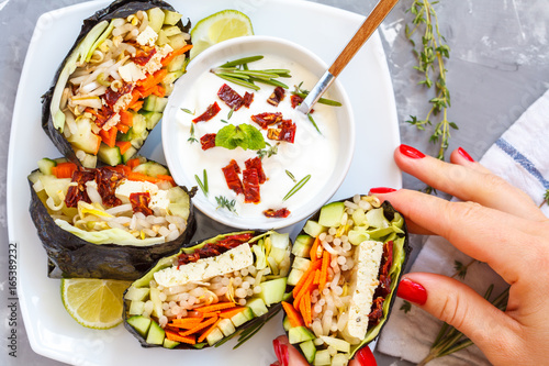 Vegan onigirazu with tofu and vegetables. Healthy vegan dinner concept. photo