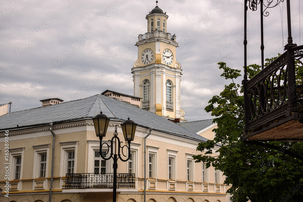 Old house and clock tower in Vitebsk. Belarus, June 2017.