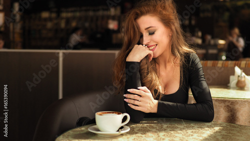 Vintage beautiful woman in restaurant cafe with cup of coffee. Stylish rich slim glamorous lady at vacation. Retro style. France.