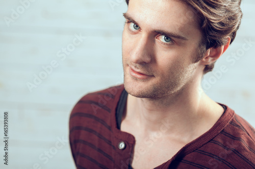 Portrait of a handsome man on old wooden background © fotofabrika