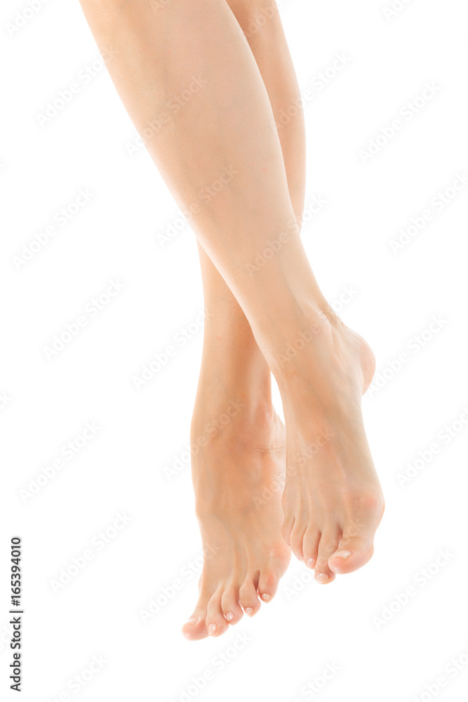 Beautiful women feet isolated on white close-up Beautiful women feet isolated on white close-up