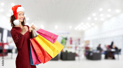 Happy woman holding shoppin...