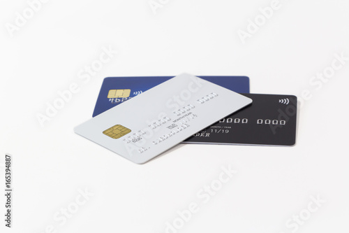 White, black and blue credit cards on white background