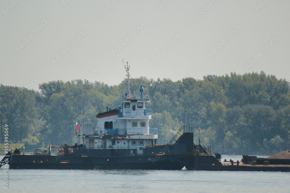 River cargo ship on the volga, telephoto shot River cargo ship on the volga, telephoto shot