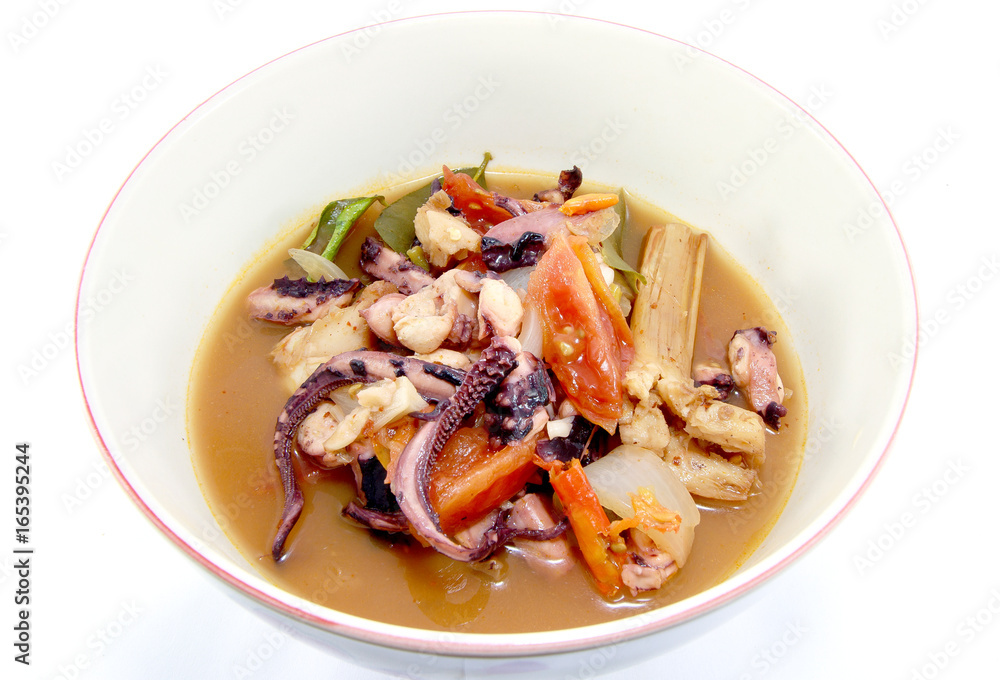 Thai traditional cuisine style hot and sour soup Spicy squid (Thai name is Tom Yam) isolated on white background, asian eating food, Thai food, close up Thai traditional cuisine style hot and sour soup Spicy squid (Thai name is Tom Yam) isolated on white background, asian eating food, Thai food, close up