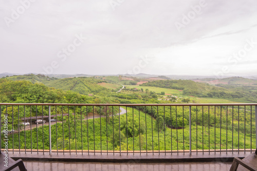 Balcony View of Mountain Forest Landscape Under Evening sky with Clouds in Soft Light