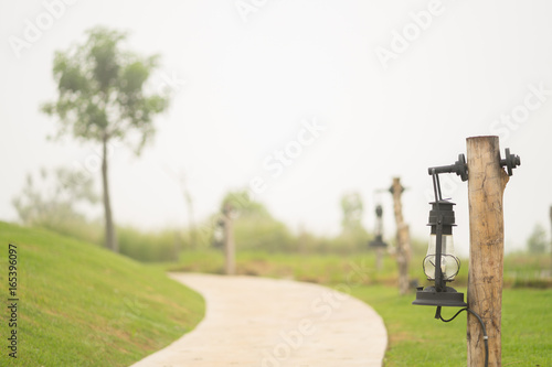 The Way of Lamp Columns with White Fog in Early Morning