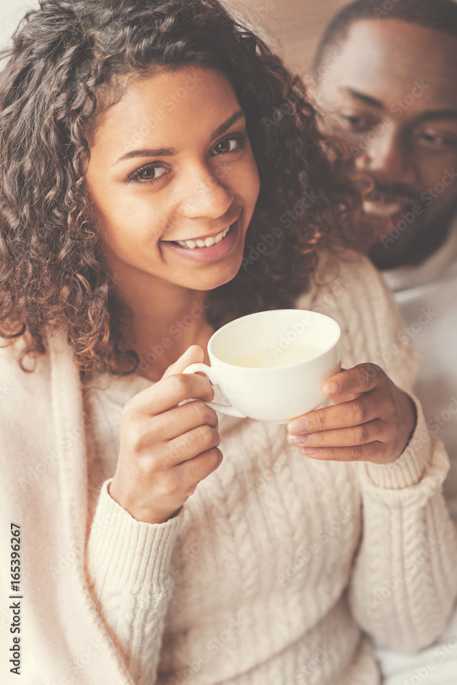 Joyful pretty woman enjoying her tea Joyful pretty woman enjoying her tea