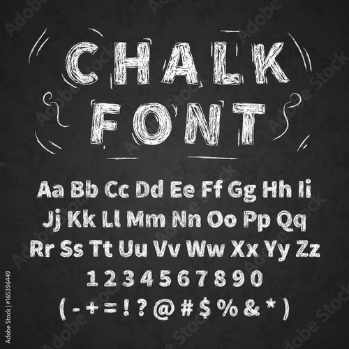 Set of retro hand drawn alphabet letters drawing with white chalk on chalkboard photo