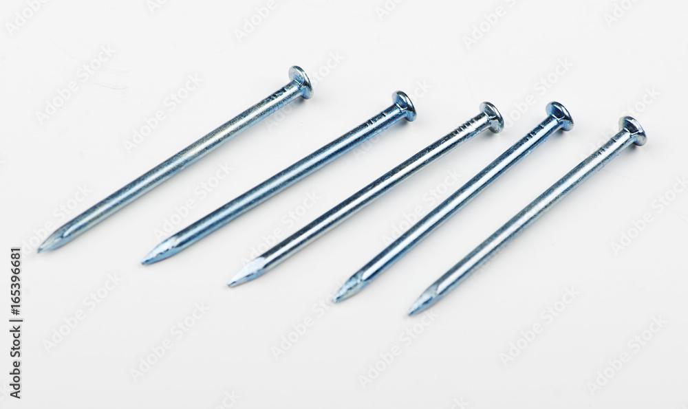 Various nails in line on white background. Copy space. Isolated. Various nails in line on white background. Copy space. Isolated.