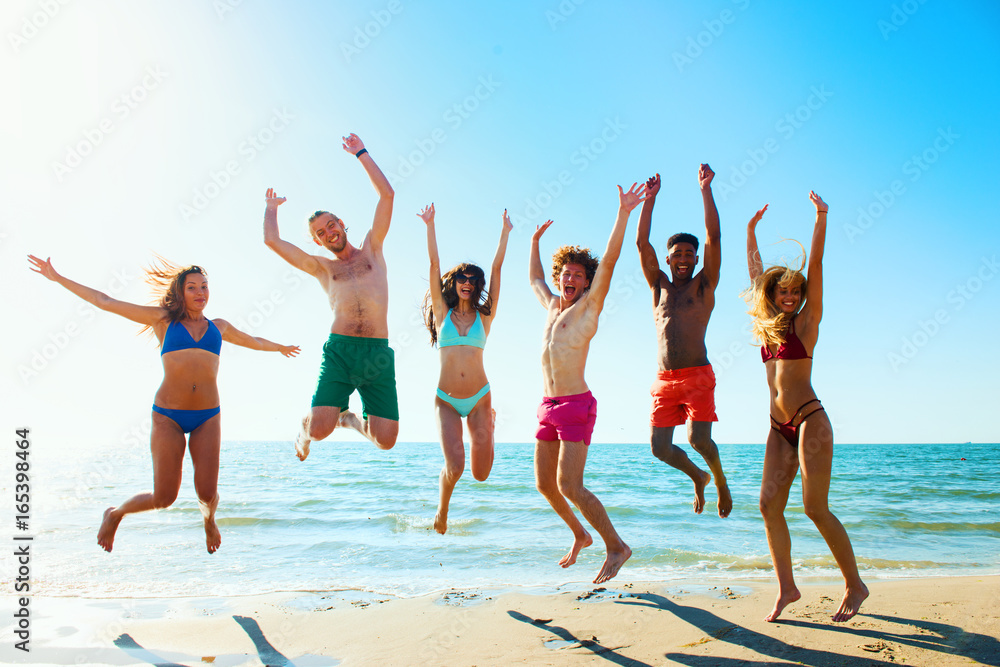 Group of friends having fun on the beach Group of friends having fun on the beach