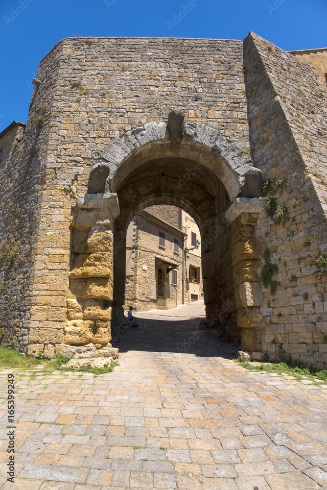 Porta all' Arco, one of city's gateways, is the most famous Etruscan architectural monument in Volterra, Italy
