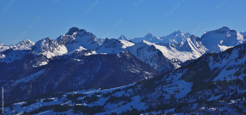Snow covered mountains seen from mount Rellerli, Switzerland.