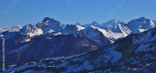 Snow covered mountains seen from mount Rellerli, Switzerland.
