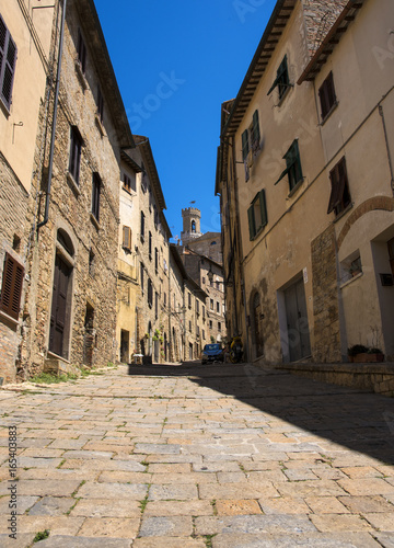 Beautiful narrow street of historic tuscan city Volterra  Italy