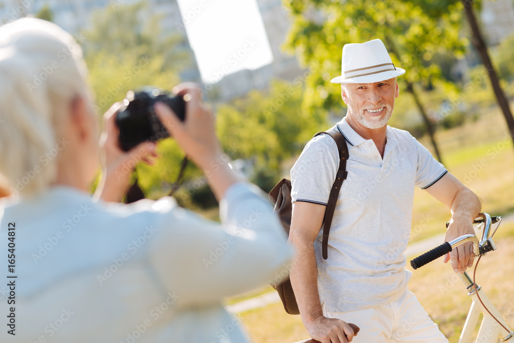 Delighted bearded man posing for his wife Delighted bearded man posing for his wife