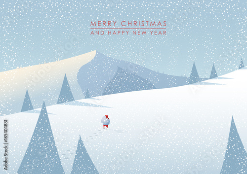 Winter mountain landscape scenery, walking Santa Claus with his bag full of presents in deep snow with pine trees surrounding him and blue sky.