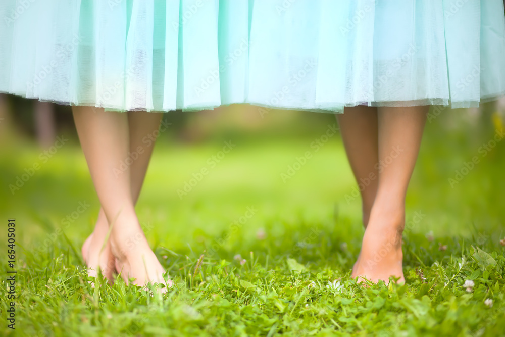 beautiful barefoot female legs in blue tutu skirt. Dance school