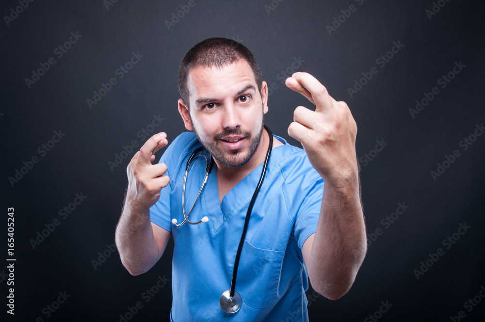 Portrait of doctor with stethoscope showing double fingers croosed Portrait of doctor with stethoscope showing double fingers croosed